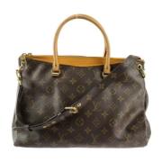 Pre-owned Brunt lerret Louis Vuitton Pallas