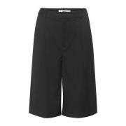 Sorte lange shorts med vide ben og sidelommer