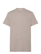 Logo Tape Tee Tops T-shirts Short-sleeved Beige Calvin Klein Jeans